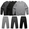 Goblin Suit: Ultra Cozy loungewear set featuring crewneck sweatshirts and matching pants in three colorways - light grey, dark grey, and black. Each sweatshirt displays Chaos Goblin text across chest, with coordinating CG logo on pants. Laid flat product display showing full set combinations.