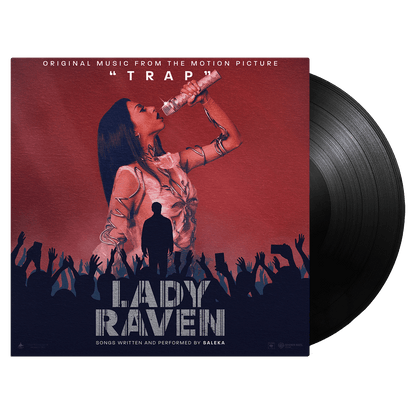 Lady Raven standard black vinyl album cover featuring a stylized silhouette performing on stage against a red backdrop, with a crowd of raised hands below and metallic text typography. Original soundtrack from the motion picture TRAP on black vinyl record with album sleeve.