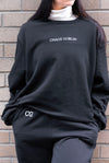 Black Goblin Crew sweatshirt with white embroidered text reading
