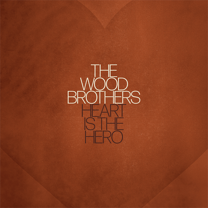 Minimalist brown vinyl album cover with The Wood Brothers Heart is the Hero title centered in white and dark brown text