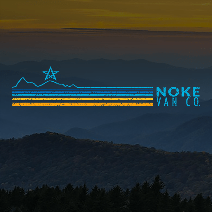 A photo of the blue ridge mountains in the background with the Noke Van Col. blue and orange mill mountain star logo in the foreground