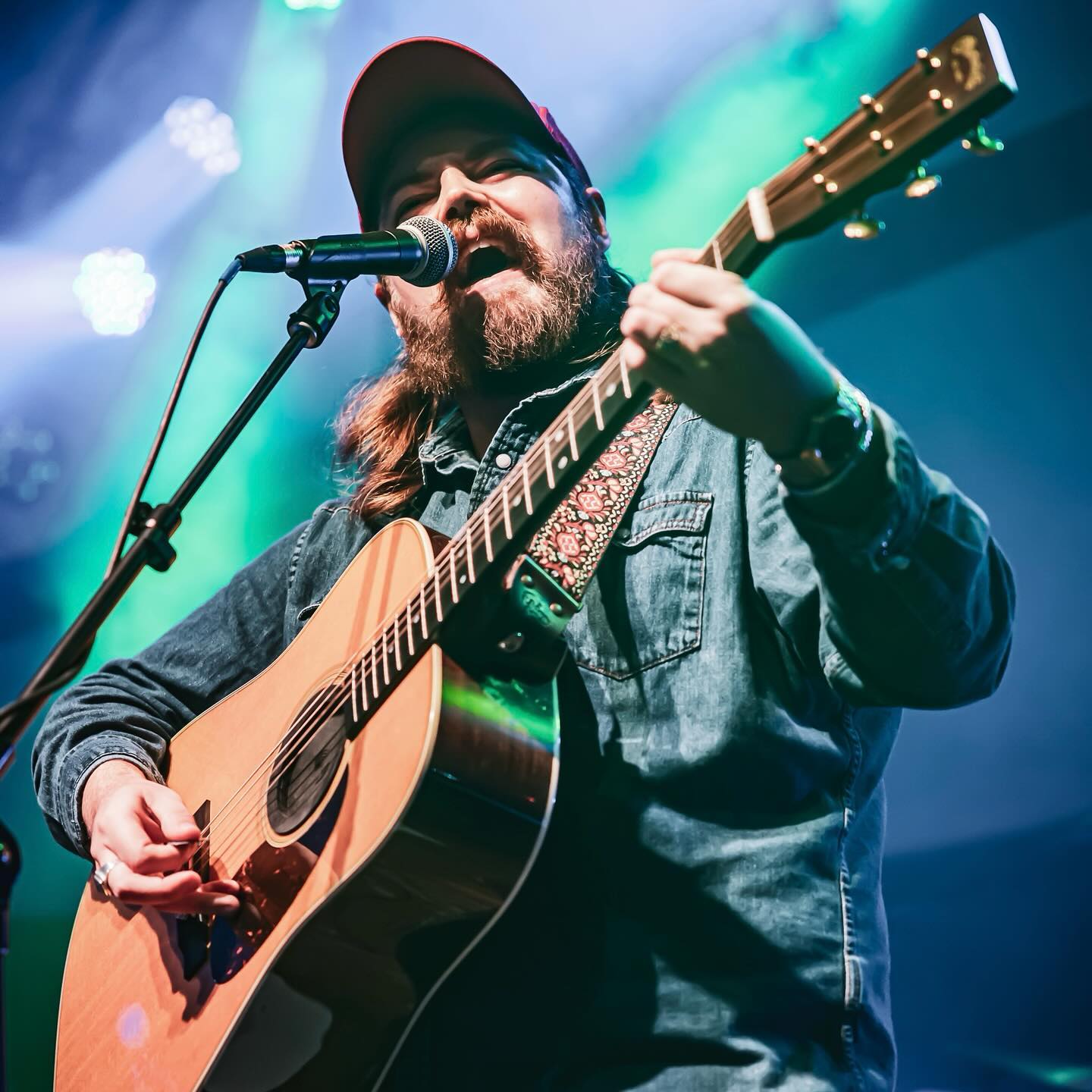 Drayton Farley signing and playing guitar close up