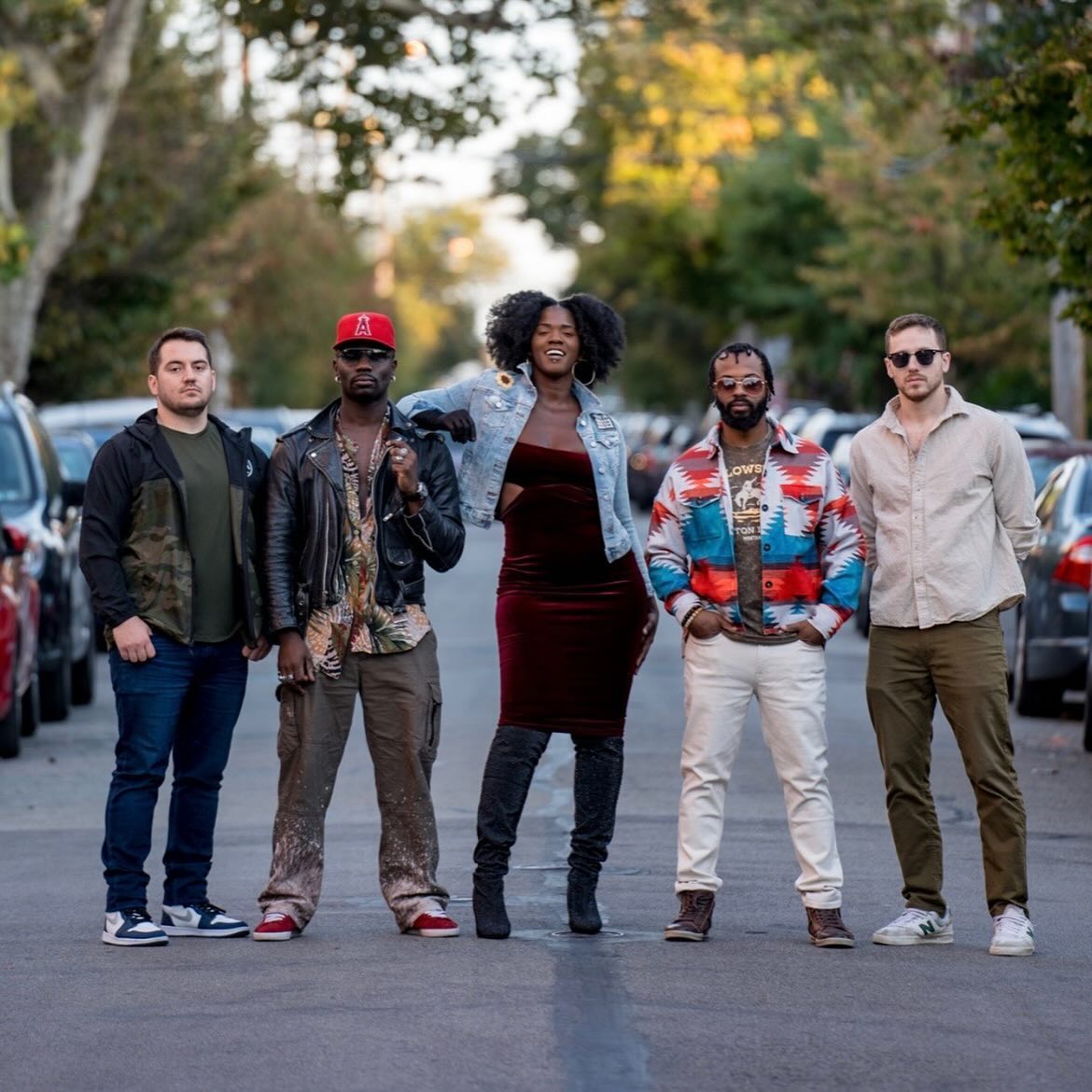 photo of the band posed on the street 