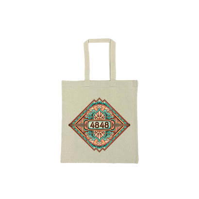 Sand color tote bag with 27″ extended handles and screenprinted with the 4848 festival mountain mandala design