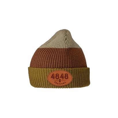 4848 Festival tri color knit beanie hat. tan, brown and green knit stripes with laser engraved faux leather logo patch