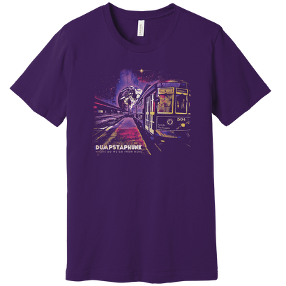 Purple Album Tee featuring artistic streetcar design with cosmic background, illuminated trolley car against a starlit cityscape in vibrant purple and gold tones. Premium cotton t-shirt with detailed urban transport artwork and nighttime space elements.