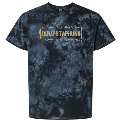 Splatter Tee featuring a black and grey tie-dye pattern with gold text logo on 100% ringspun cotton. Unique marble-like dye effect creates a moody, textured background with metallic gold branding centered on chest.