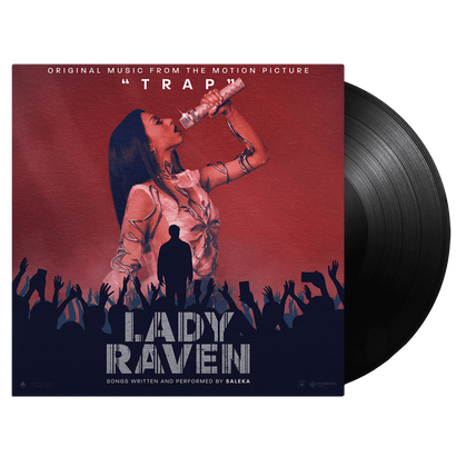 Lady Raven standard black vinyl album cover featuring a stylized silhouette performing on stage against a red backdrop, with a crowd of raised hands below and metallic text typography. Original soundtrack from the motion picture TRAP on black vinyl record with album sleeve.