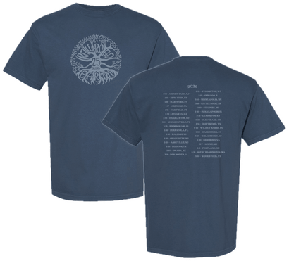 Navy blue short-sleeve shirt with circular artistic text on front and tour dates listed on back in light print