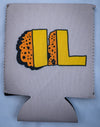 Tan fabric drink sleeve with bold yellow and orange stylized letters amid a black speckled pattern design