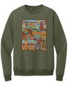 Military green crewneck sweatshirt featuring a colorful outdoor circus festival design with bicycle and balloons.
