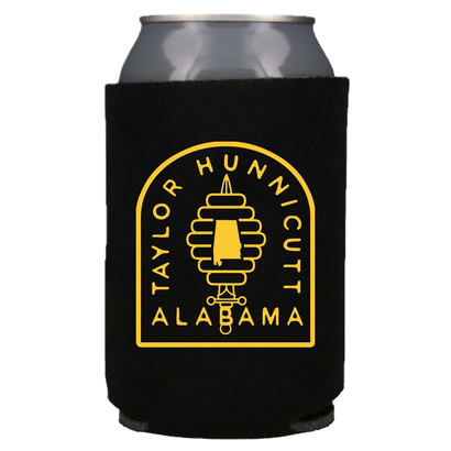 Black foam koozie with yellow circular logo featuring a beehive and 'Taylor Hunnicutt Alabama' text, holding a silver beverage can