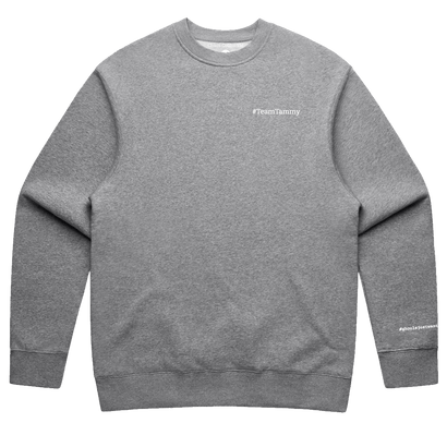 Team Tammy Crew: Ultra Cozy sweatshirt in heather gray with white embroidered text on chest and sleeve. Fleece-lined crewneck with ribbed collar, cuffs, and hem displaying classic athletic sweatshirt styling.