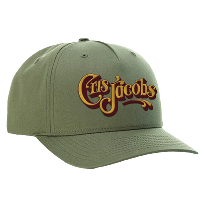 Olive green structured snapback hat with Cris Jacobs script logo embroidered in yellow and red on the front, featuring a pre-curved bill and cotton twill fabric