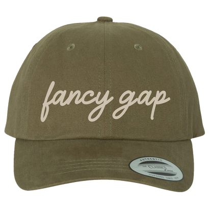 Fancy Gap script logo on a loden green hat