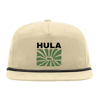 Beige snapback hat with black rope trim featuring green abstract floral design and 'HULA' text in black, embroidered on front panel