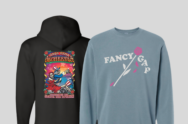 A blue fancy gap sweatshirt in the foreground and a black dark star orchestra hoodie in the backaground