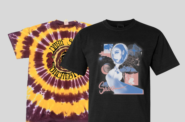 Two t-shirts, one black in the foreground and a maroon and yellow tie-dye in the background