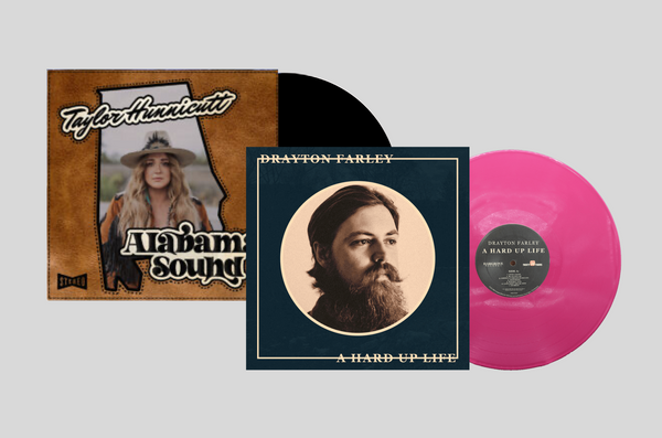 One black vinyl album by taylor hunnicutt in the background, and one pink vinyl album by drayton farley in the foreground