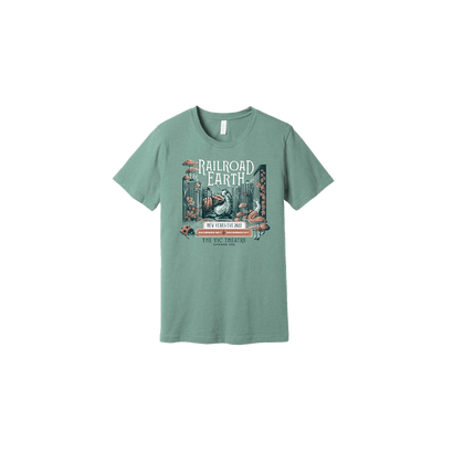 RRE NYE 2022 Tee featuring a whimsical sage green t-shirt design with a vintage-inspired illustration of a cityscape, giant snail, and mushrooms in muted colors, with Railroad Earth text prominently displayed at the top