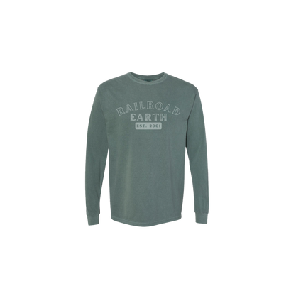 EST. 2001 Long Sleeve shirt in spruce green featuring Railroad Earth logo text and establishment date on front chest, with small tree detail on back hip. Comfort Colors cotton material in a classic long-sleeve design.