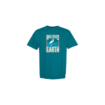 Heron Short Sleeve t-shirt in topaz blue featuring Railroad Earth's signature heron logo in white against a geometric background. Classic crew neck design with high-quality comfort colors fabric in a casual, unisex style.