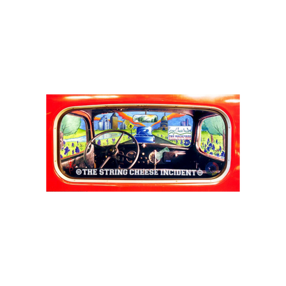 2001 Austin Backyard Poster featuring a vibrant view through a red car's windshield and side windows, showing colorful festival scenes with rolling hills, blue skies, and concert venues. The String Cheese Incident logo appears at the bottom in a retro-style automotive frame.