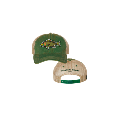 2022 Jamaica Fish Trucker Hat featuring a green front panel with embroidered red snapper design, tan mesh back, and adjustable green snap closure. The Jamaica Incident 2023 text is embroidered on the rear band.