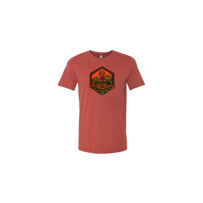 Mountain Guitar T-Shirt Rust featuring a hexagonal graphic design with mountain scenery and guitar imagery in rust-colored tri-blend fabric, displaying The String Cheese Incident's signature mountain guitar logo on a comfortable unisex t-shirt