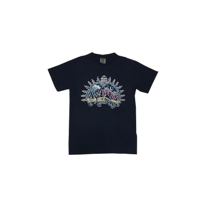 Navy Mountain Wave Tee featuring a decorative mountain and wave graphic design in light blue and purple tones against a dark navy background. The artistic pattern includes ornate sunburst details and decorative elements, showcasing The String Cheese Incident's signature style on a classic cotton t-shirt.