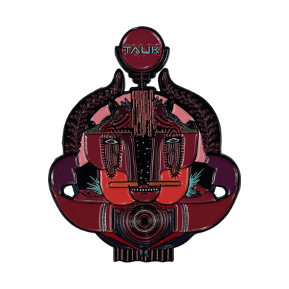 Chaos Companion Pin featuring abstract geometric design in deep red and purple hues. Stylized face with circular eyes and prominent TAUK text. Intricate patterns and shapes form a unique, artistic enamel pin approximately 2.5 inches tall.