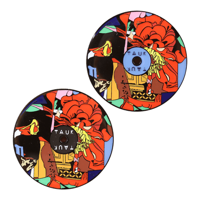 Circular pins featuring vibrant collage-style artwork with large red flowers, colorful abstract shapes, and text elements. Two identical pins shown, one in black and one in blue, showcasing the Collisions Pin design for Shopify product selection.