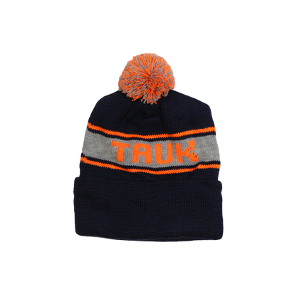 Navy blue knit beanie with orange and gray striped band featuring 'TAUK' text and topped with orange and gray pom-pom, displayed on white background